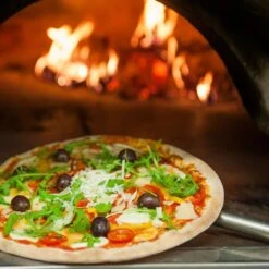 Pizzaschaufel Aus Aluminium - Ø 30 Cm 7 Pizzaschaufel Aus Aluminium - Ø 30 Cm -Küchenwelt Geschaft stockkkbild 3482